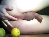 Sissy plays with apples