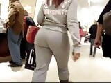 Candid redhead girl big bubble ass in grey pants at store